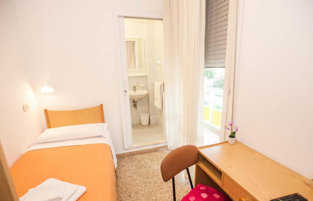 Postel nebo postele na pokoji v ubytování Hotel Massimo