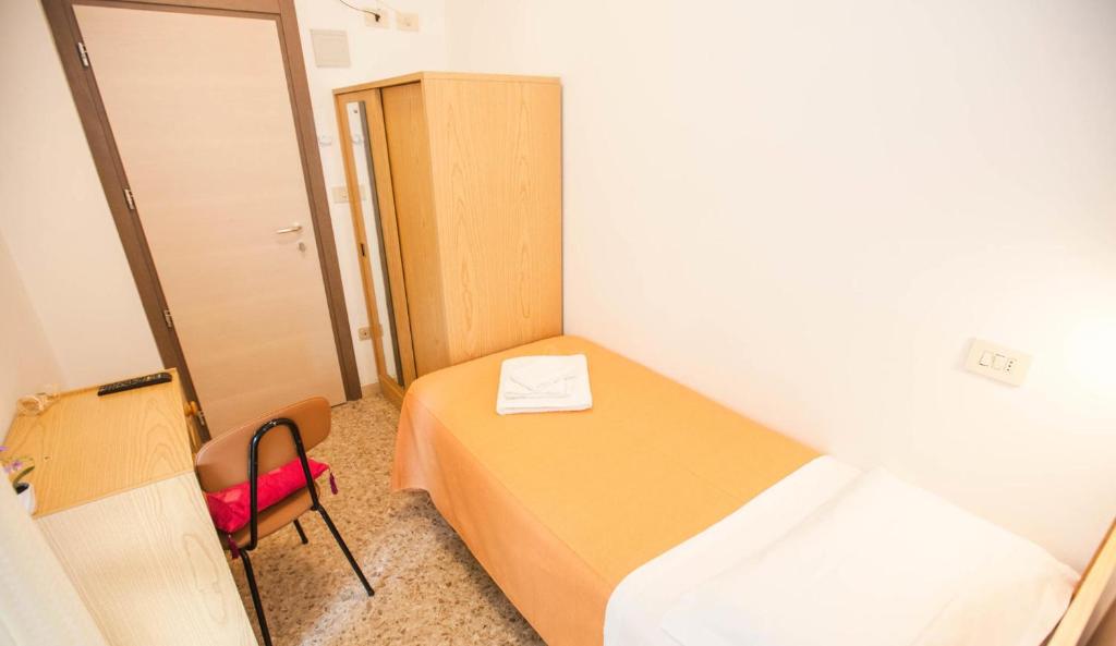 Postel nebo postele na pokoji v ubytování Hotel Massimo