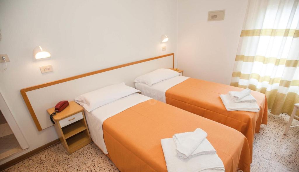 Postel nebo postele na pokoji v ubytování Hotel Massimo
