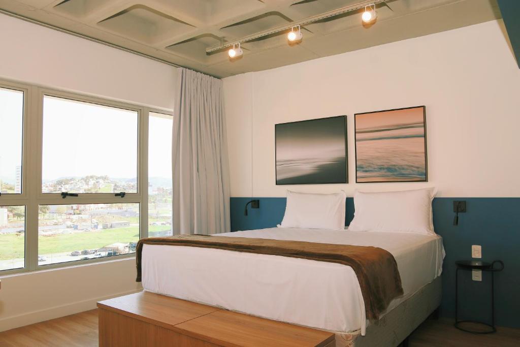 Ένα ή περισσότερα κρεβάτια σε δωμάτιο στο Atrium Studios by Xtay - Tranquilo, Completo e Com Tudo por Perto