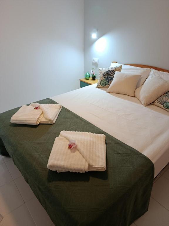 a bedroom with two beds with towels on them at BRISA DEL MAR en primera línea in Torres-Torres
