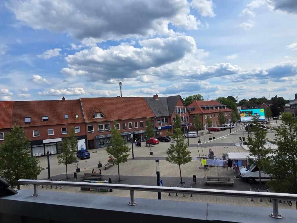 a view of a street with buildings and a parking lot at Moderne Wohnung am Marktplatz in Sögel