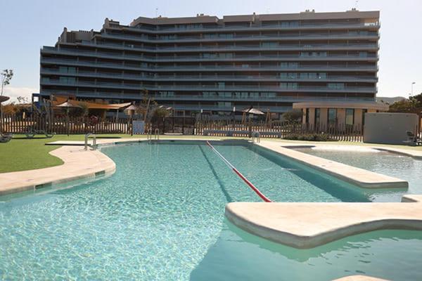 a large swimming pool in front of a large building at Casa Sueno Dream in Playa Honda