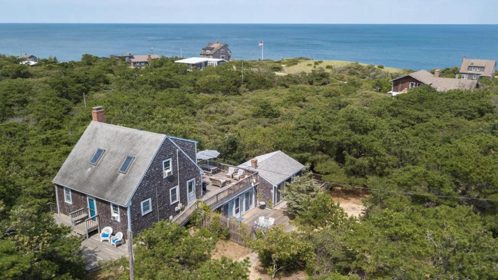 an aerial view of a house with the ocean in the background at Walk to Oceanside Beach in Wellfleet