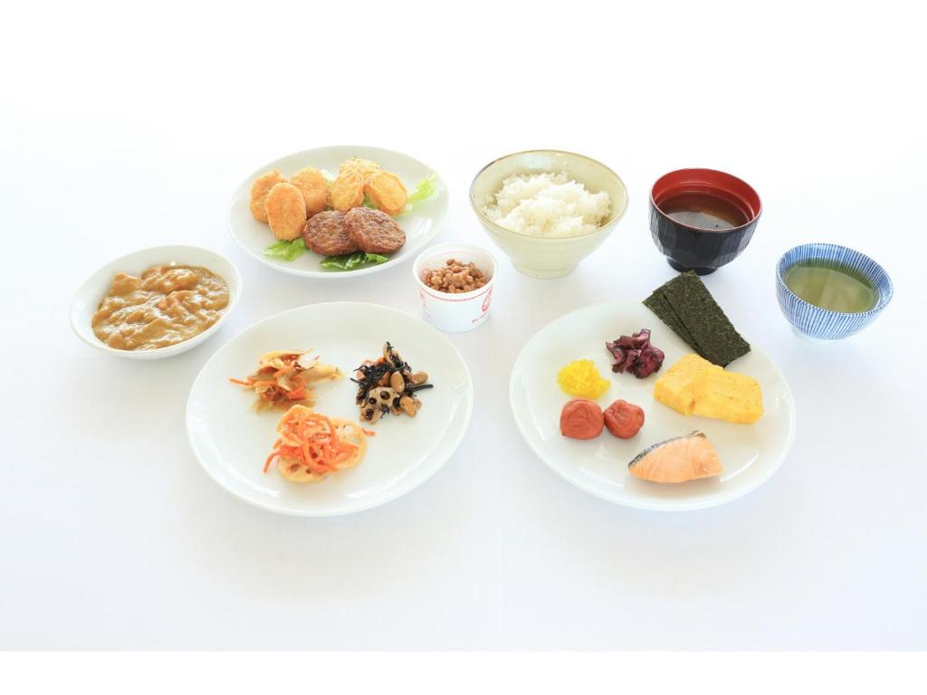 a group of plates with different types of food at Smile Hotel Kumagaya - Vacation STAY 89997v in Kumagaya
