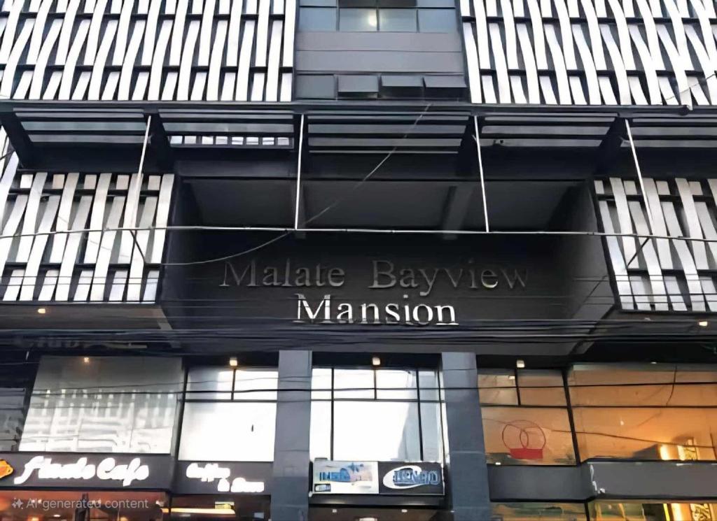 a building with a sign that reads malleable bakery mayhem at bayviewmansion malate in Manila
