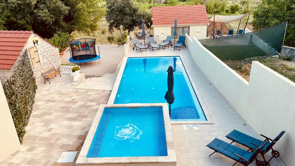 an overhead view of a swimming pool on a house at Holiday Home Leon - Imotski - Makarska in Drum