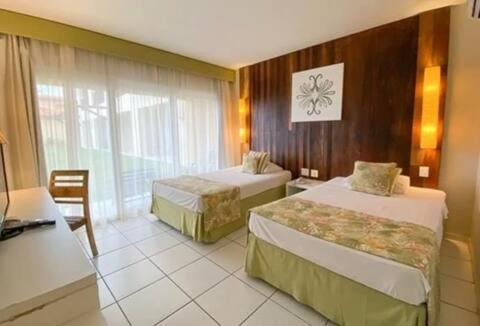 Postel nebo postele na pokoji v ubytování Suíte aconchegante vista jardim