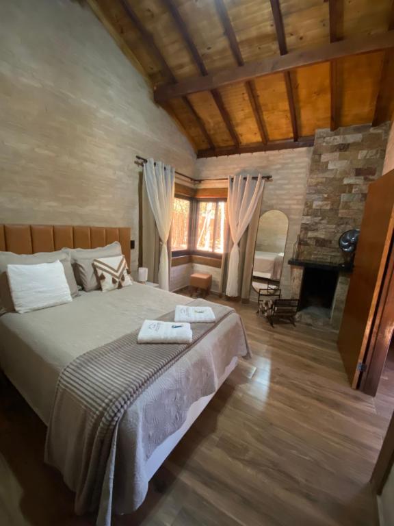 Postel nebo postele na pokoji v ubytování Chalé Encantos da Serra