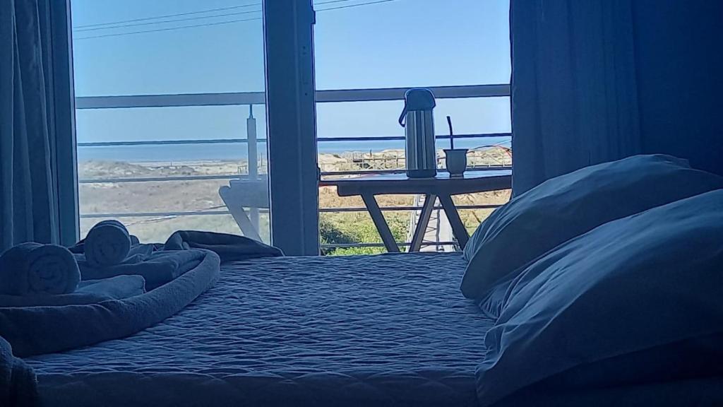 Ένα ή περισσότερα κρεβάτια σε δωμάτιο στο Pousada Vista da Barra
