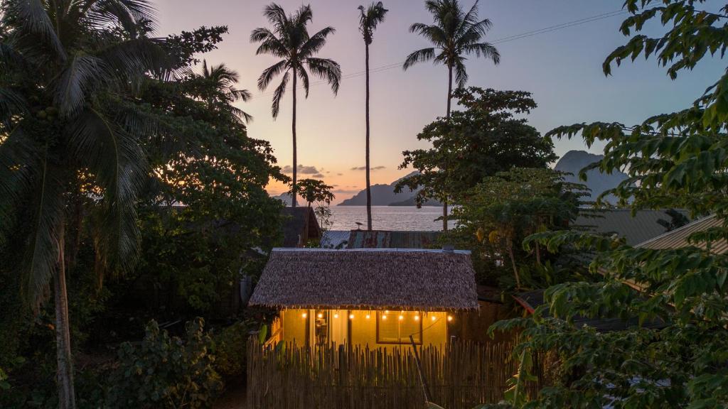a small house with lights on top of it at La Casita in El Nido