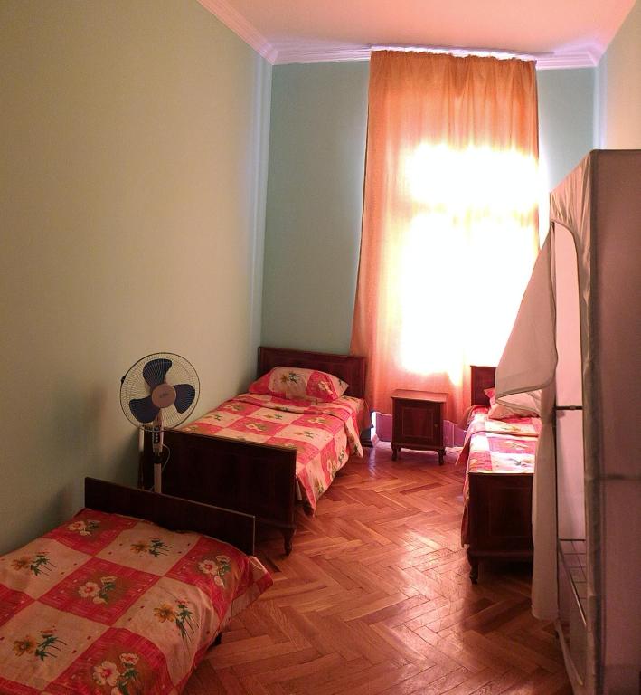 Postel nebo postele na pokoji v ubytování Lemon Family GuestHouse