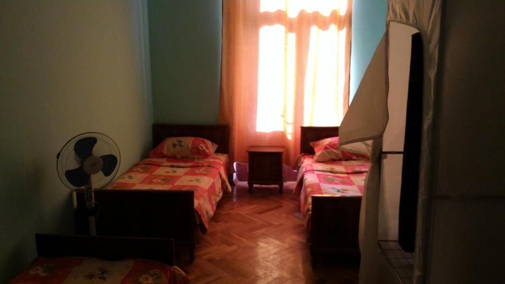 Postel nebo postele na pokoji v ubytování Lemon Family GuestHouse