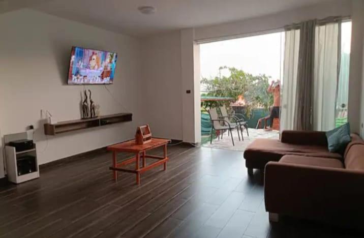 a living room with a couch and a table at Asia Casa in Asia
