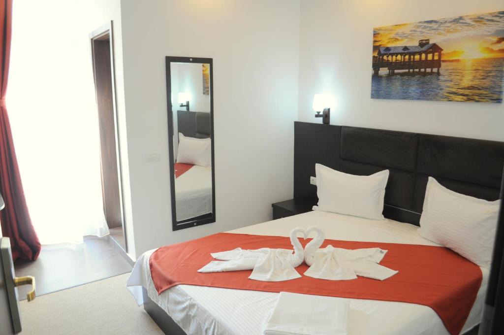 Postel nebo postele na pokoji v ubytování Hotel Evia