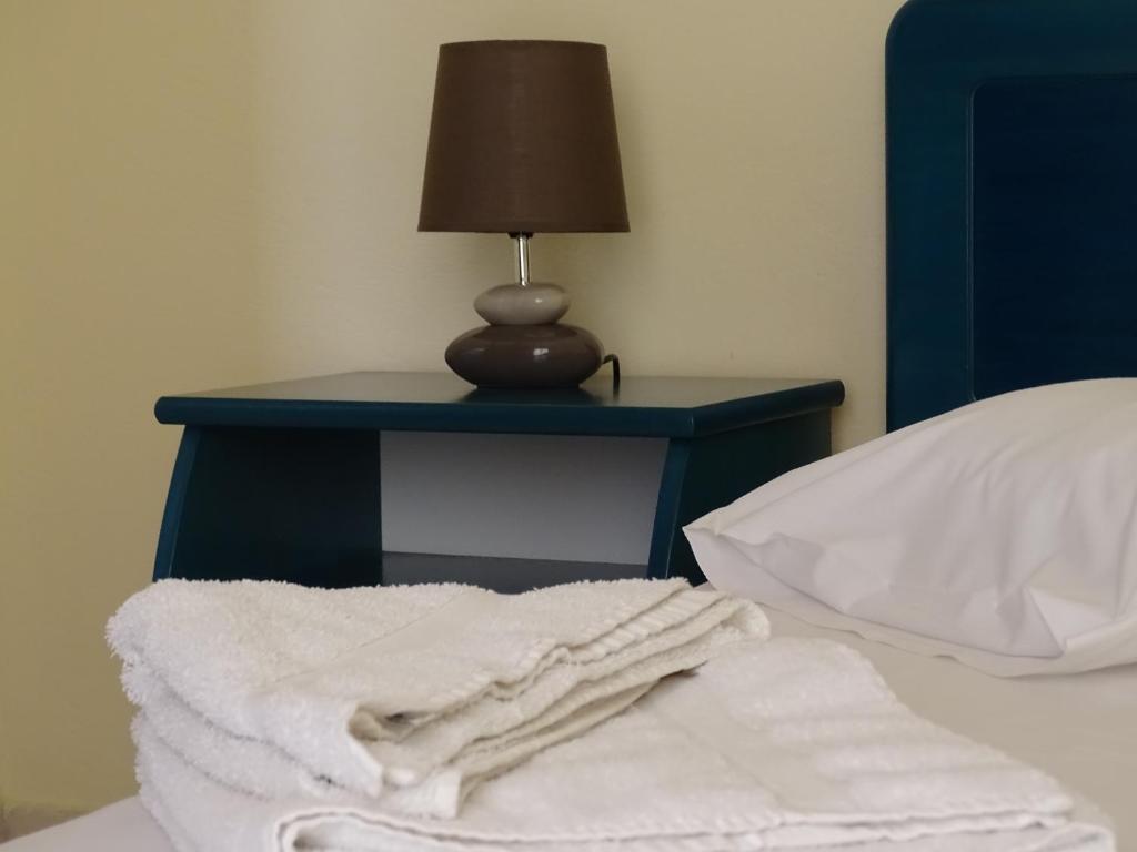 Postel nebo postele na pokoji v ubytování Flokos