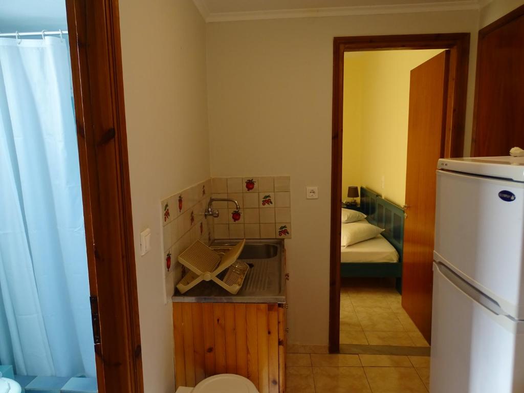 Postel nebo postele na pokoji v ubytování Flokos