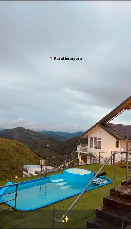 a house with a swimming pool in the yard at Castra villas - Pool Villa in Parunthumpara in Vandiperiyār