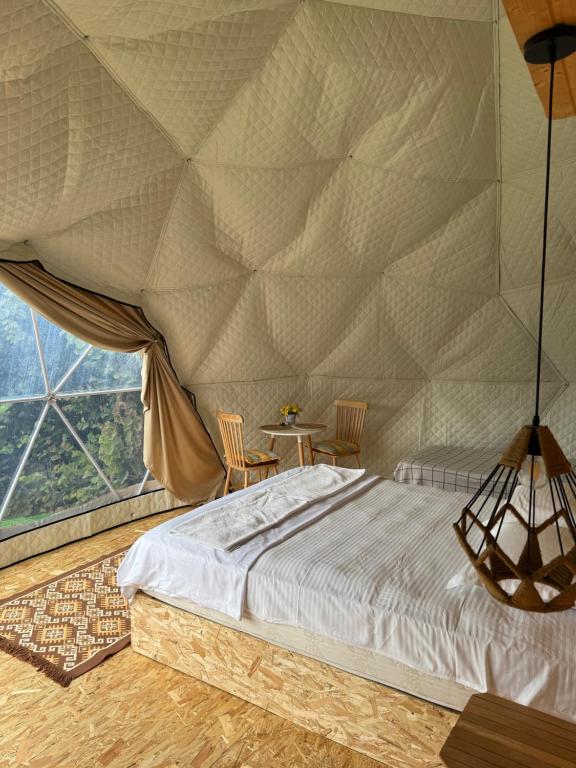 Postel nebo postele na pokoji v ubytování Mtirala Glamping