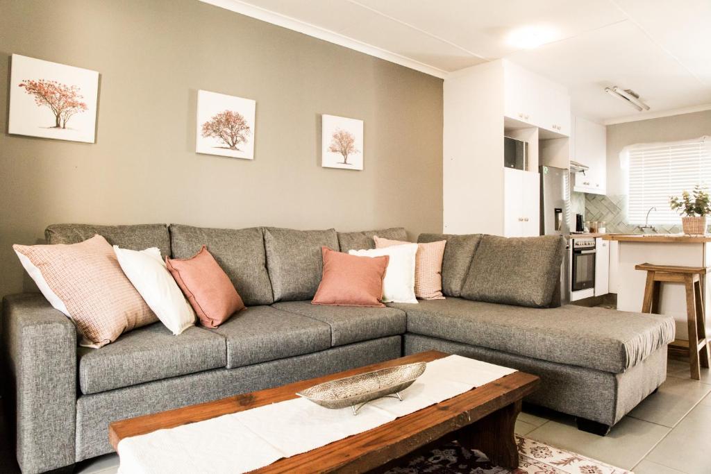 a living room with a couch and a table at Horizon Village 15 in Windhoek