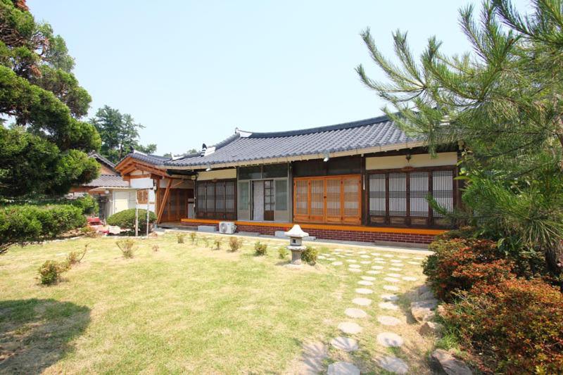 a house with a garden in front of it at Sanminjae in Jeonju
