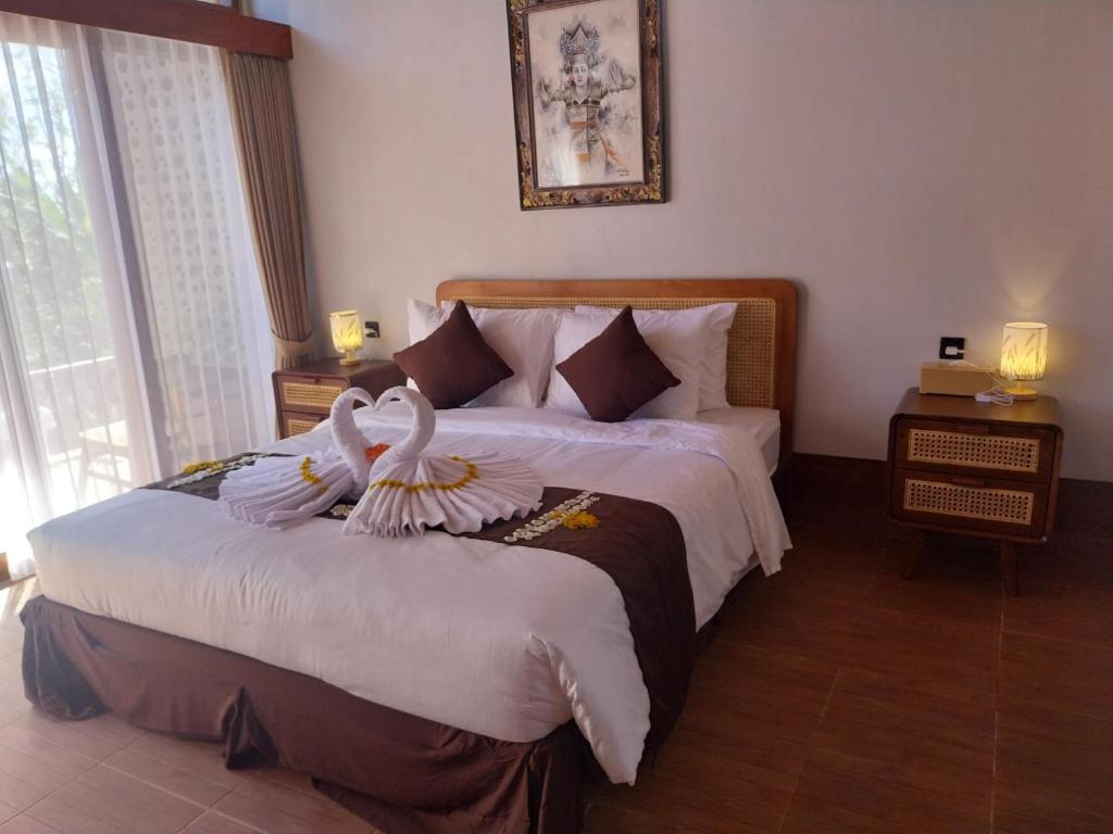 En eller flere senge i et værelse på Air ilir Grand Villa