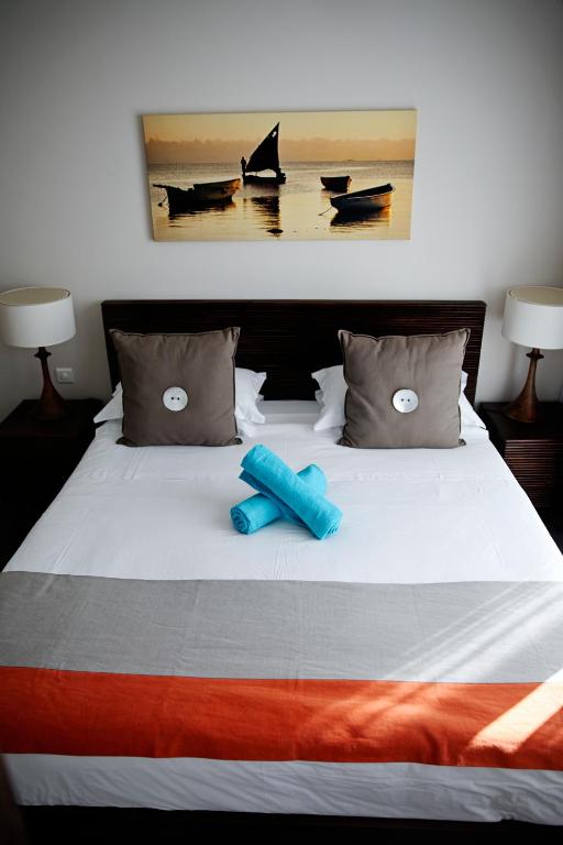 Postel nebo postele na pokoji v ubytování Sunset Coast Apartment