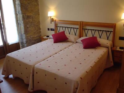 Postel nebo postele na pokoji v ubytování Hostal Restaurante Arangoiti