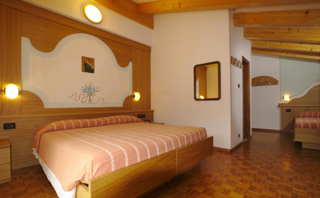 Postel nebo postele na pokoji v ubytování Charme Hotel Nevada