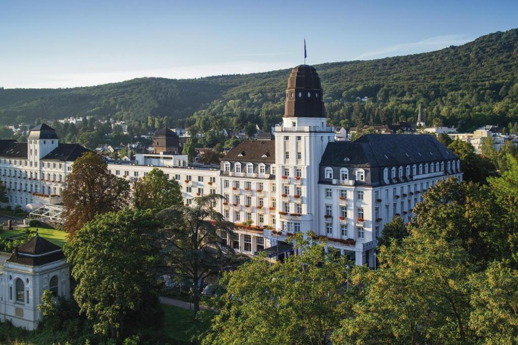 a view of a large white building with a tower at Steigenberger Hotel Bad Neuenahr in Bad Neuenahr-Ahrweiler