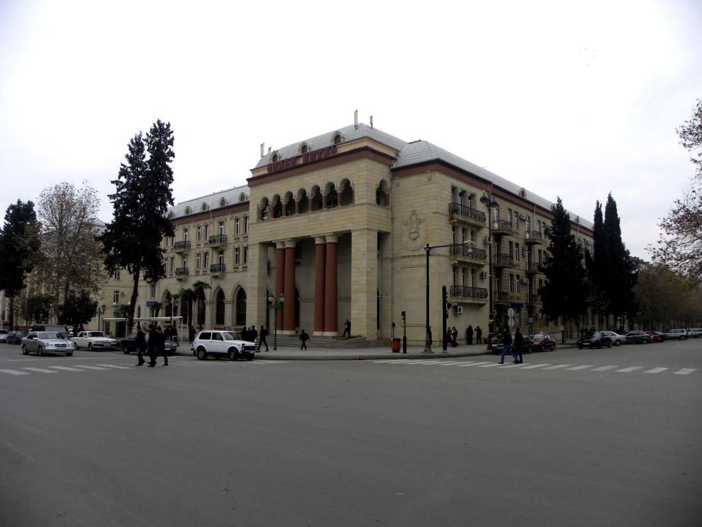 a large building on the corner of a street at Ganja Hotel in Ganja