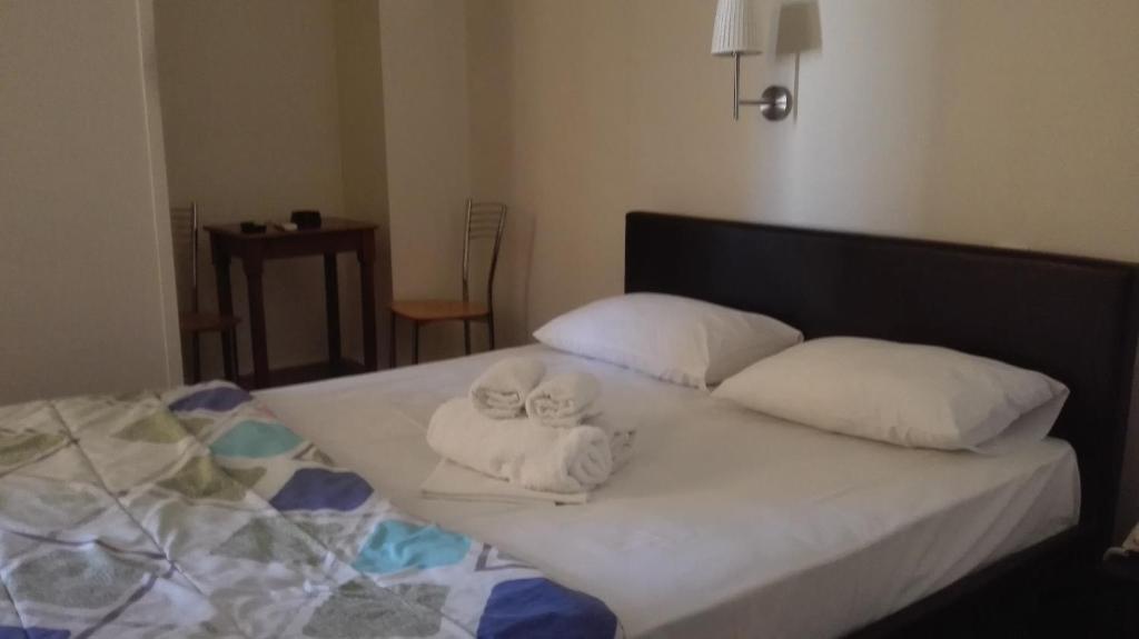 Postel nebo postele na pokoji v ubytování Hotel Ionion