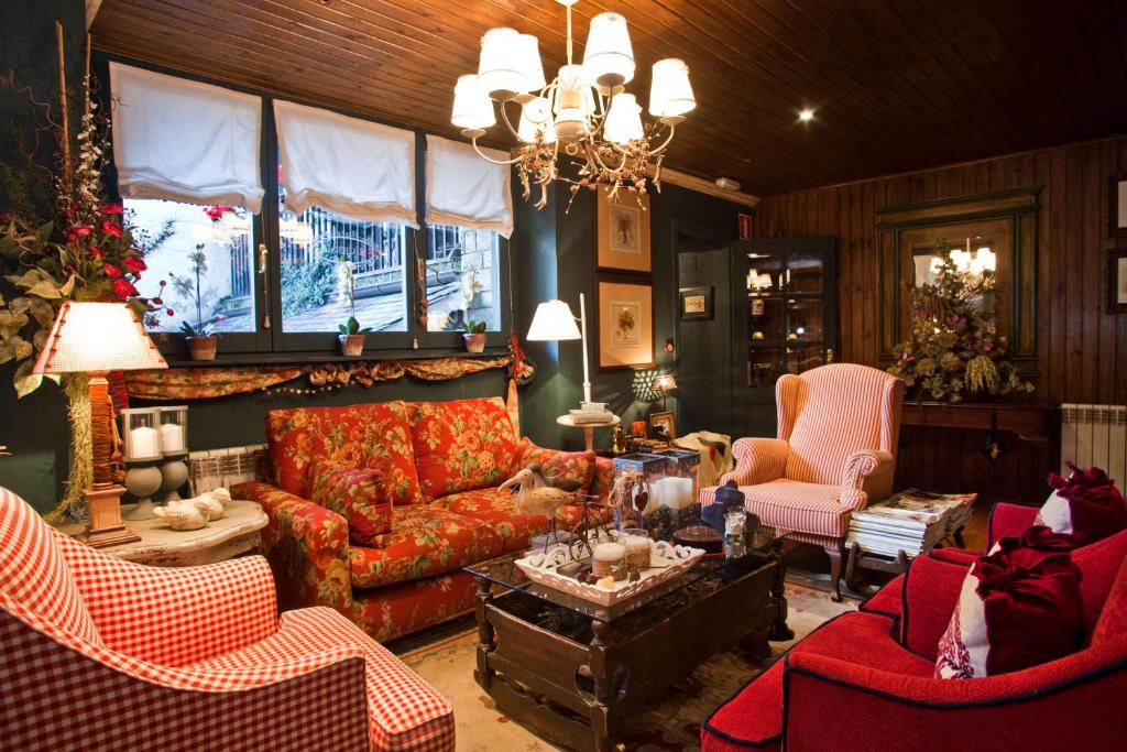 
a living room filled with furniture and decor at Hotel El Ciervo in Vielha
