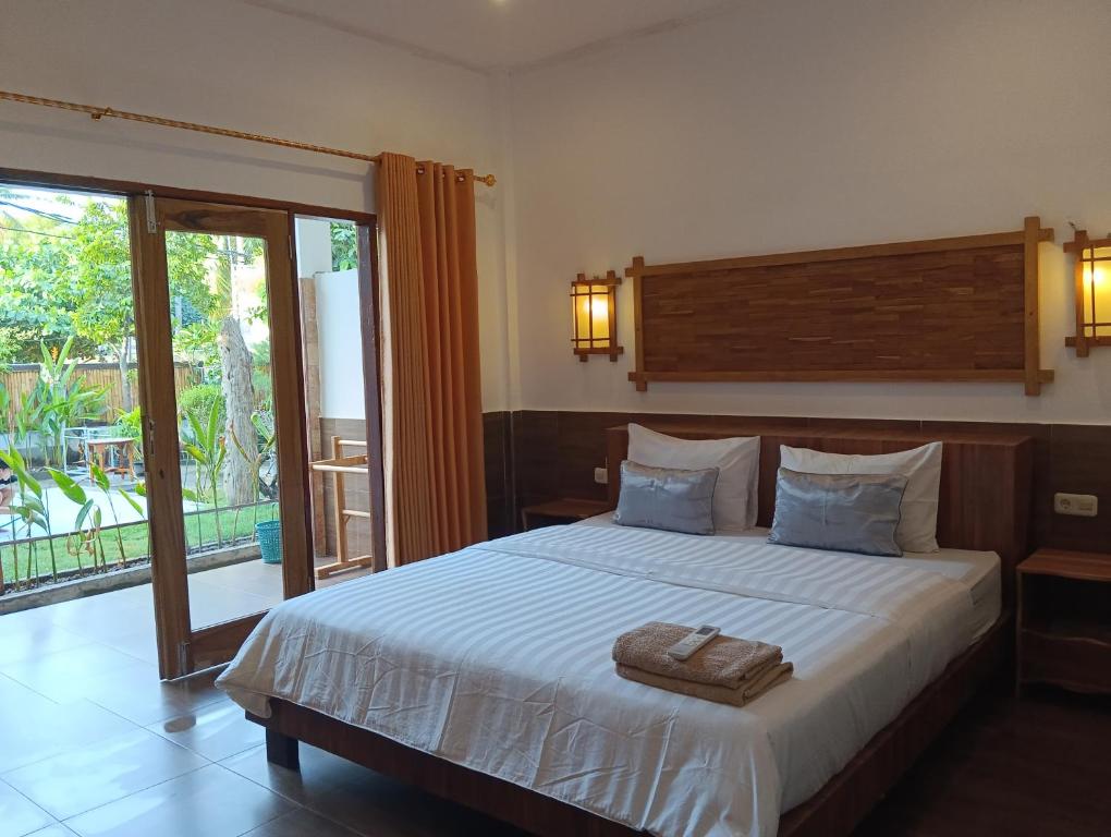 Postel nebo postele na pokoji v ubytování Dili gili