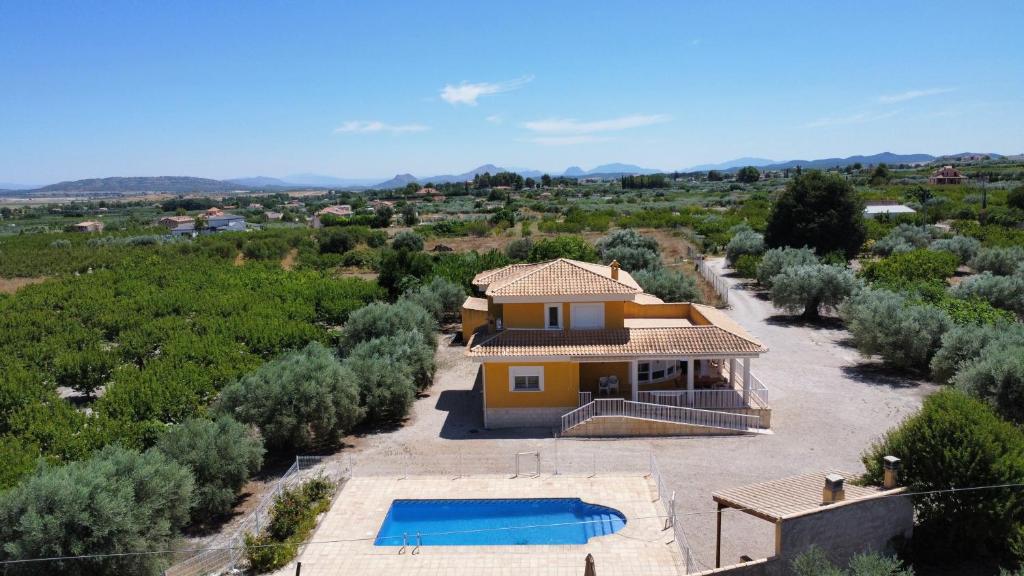 an aerial view of a house with a swimming pool at Aldora Rural Casa con piscina in Moratalla