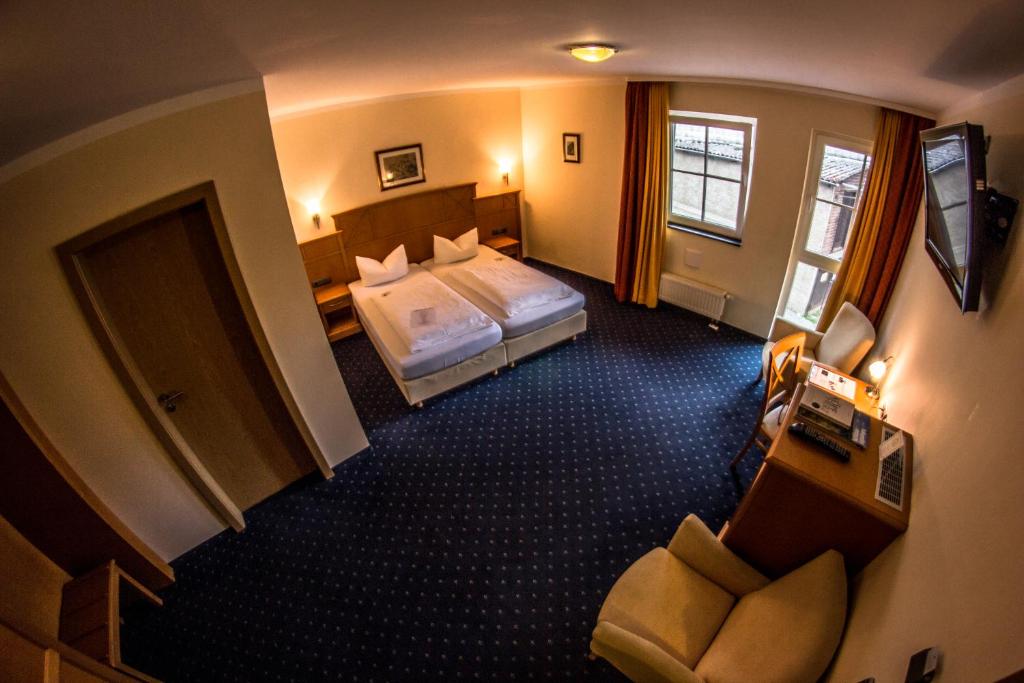 Postel nebo postele na pokoji v ubytování Hotel Blaue Ecke