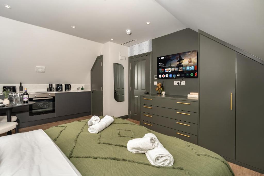 a bedroom with two beds with towels on them at Arnos Grove Gem AC 1BR Sleeps 2 WiFi & Parking in New Southgate