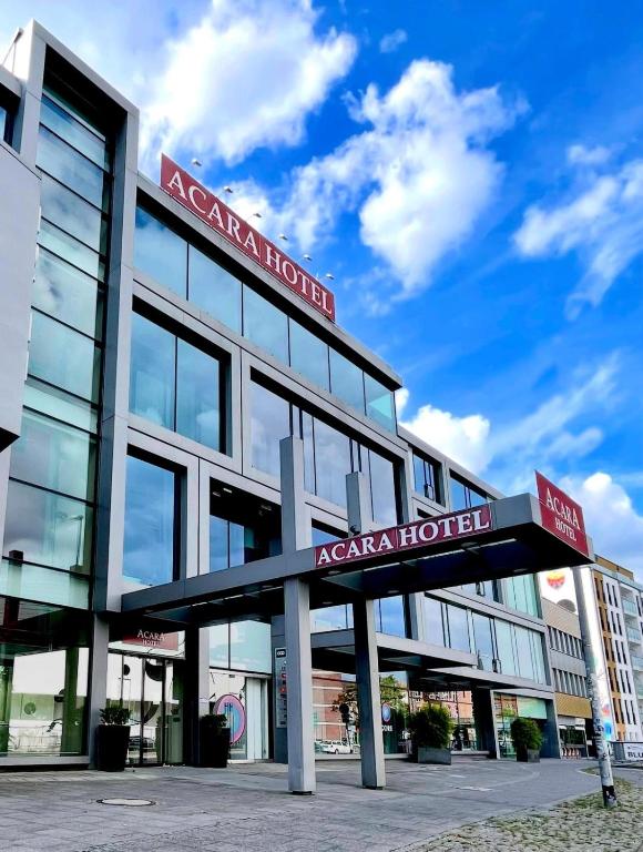 a building with a sign for a hospital at Aspire AcarA Oldenburg, Trademark Collection by Wyndham in Oldenburg