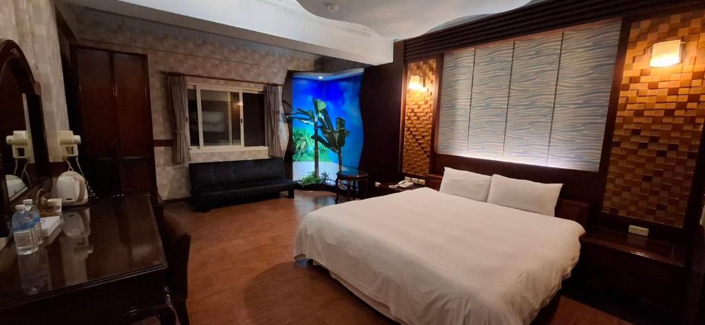 En eller flere senge i et værelse på 晶想汽車旅館