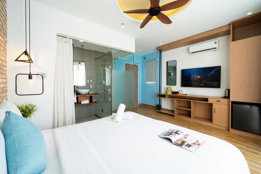 Giường trong phòng chung tại Sea Vista Boutique Hotel & Apartment