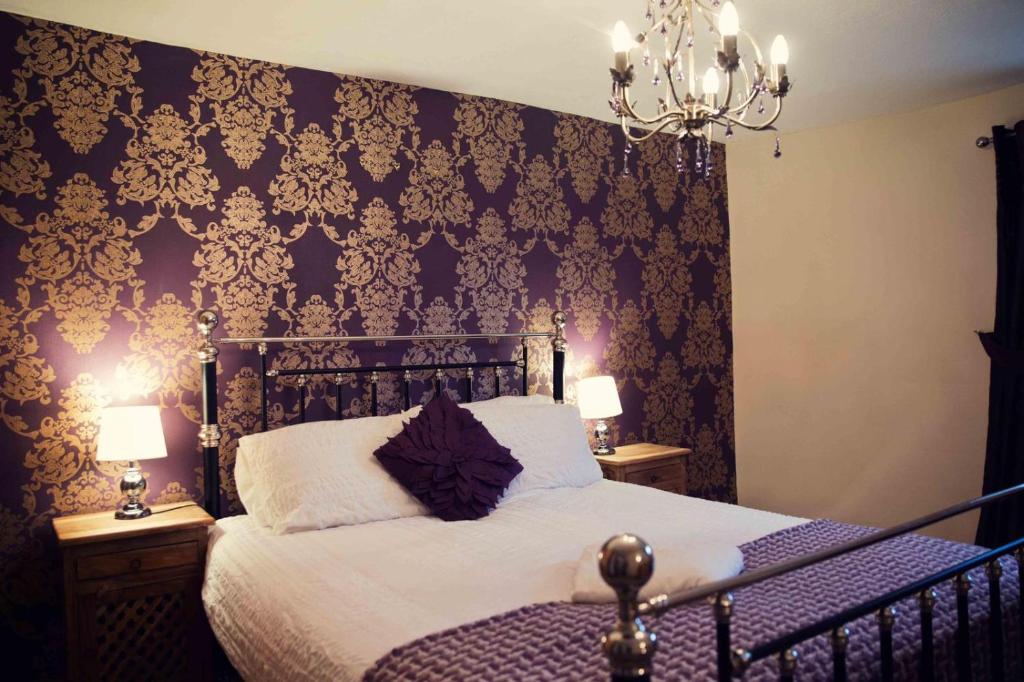 Ένα ή περισσότερα κρεβάτια σε δωμάτιο στο Marketplace Retreat