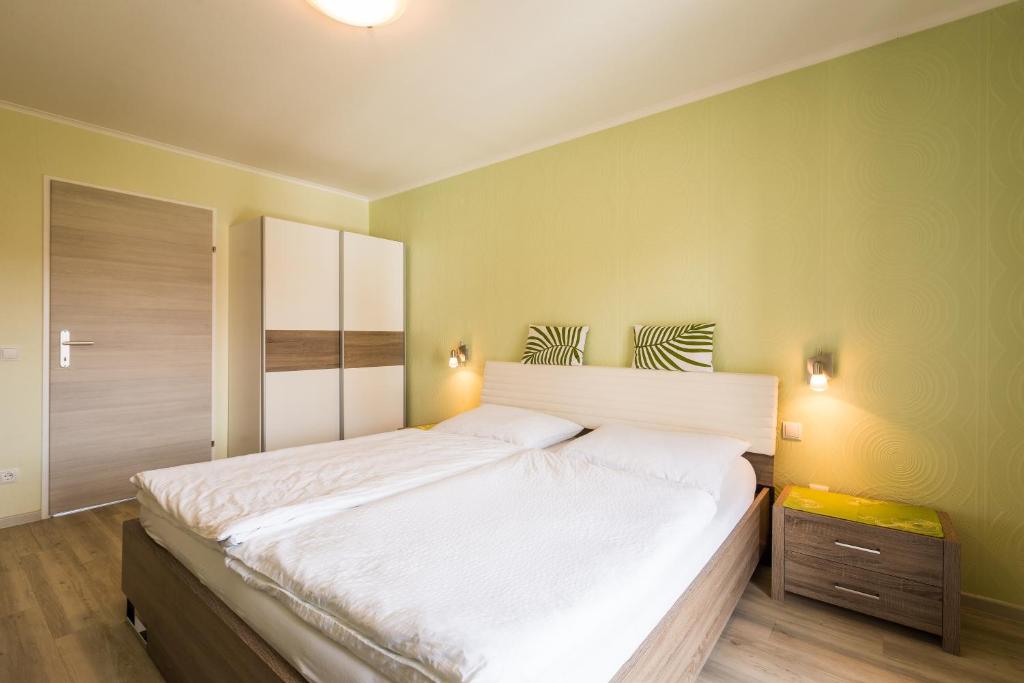 Postel nebo postele na pokoji v ubytování Gästehaus - Doris - Wenzl