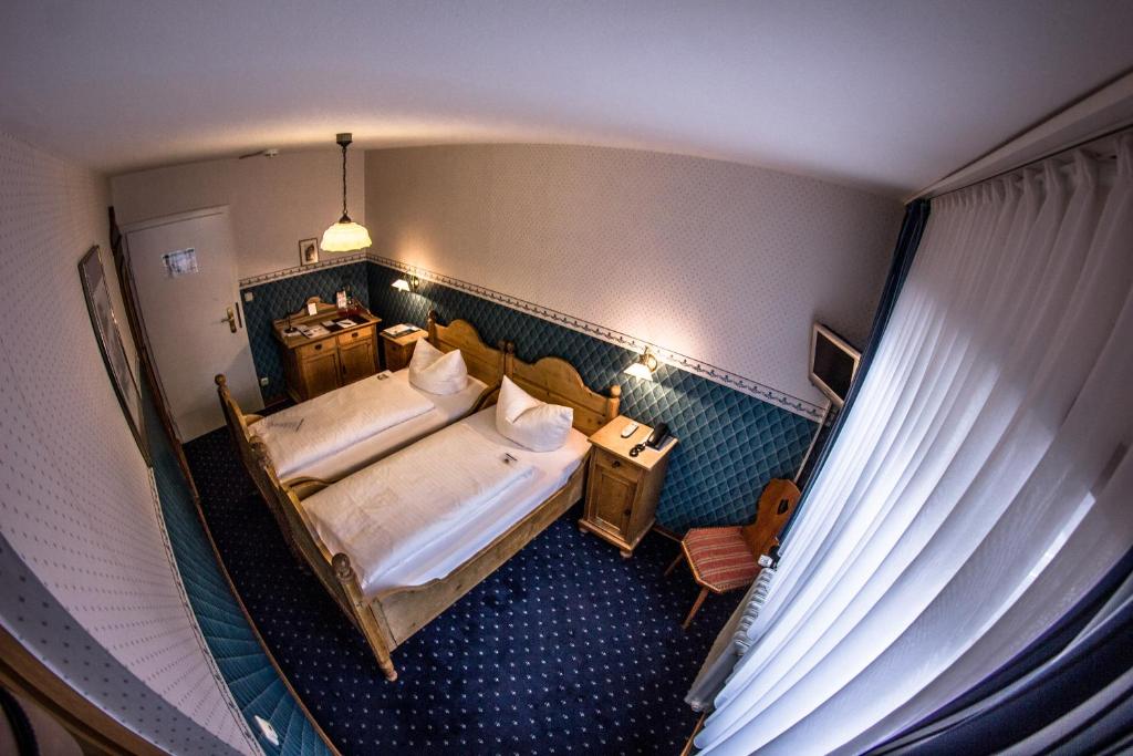 Postel nebo postele na pokoji v ubytování Hotel Blaue Ecke