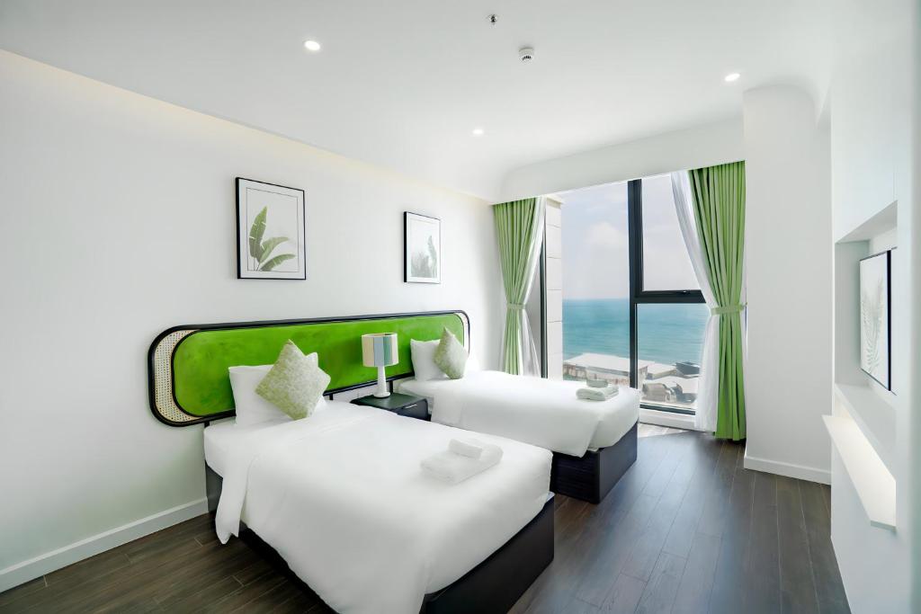 Giường trong phòng chung tại Sole Casa Phu Quoc