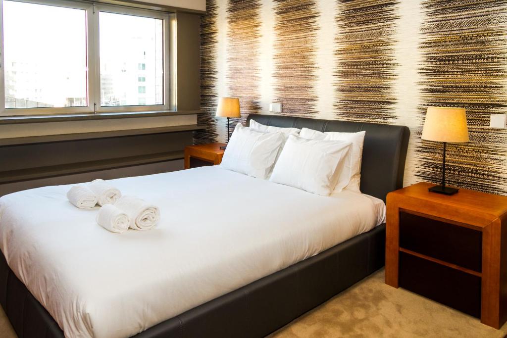 Voodi või voodid majutusasutuse Liiiving in Matosinhos - High Sea Condo toas