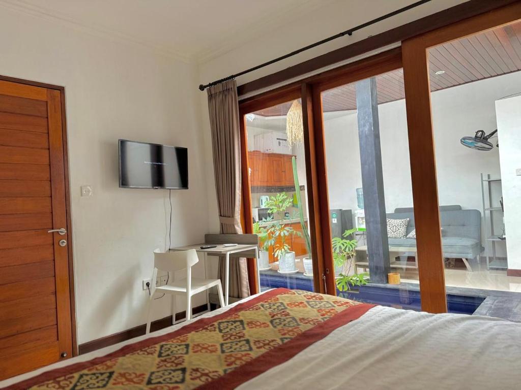 En eller flere senge i et værelse på CWB Villa