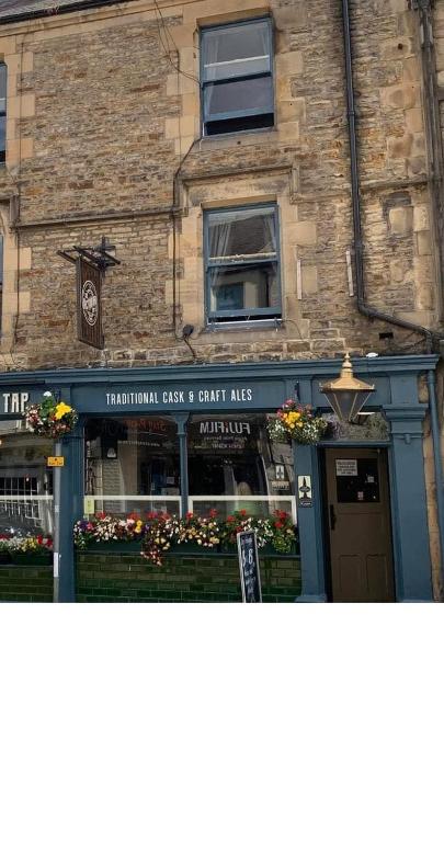 a building with a sign that reads the traditional clash and craft arts at The Tap Rooms in Hexham