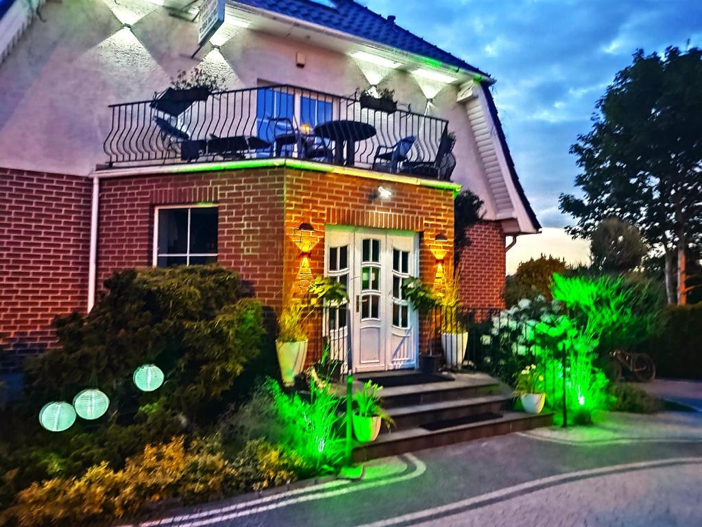 a house with a white door and a balcony at Willa Cyklada, grill, śniadania, jezioro,przystań,tawerna-200m, park linowy-400m, centrum,aquapark-900m in Mikołajki