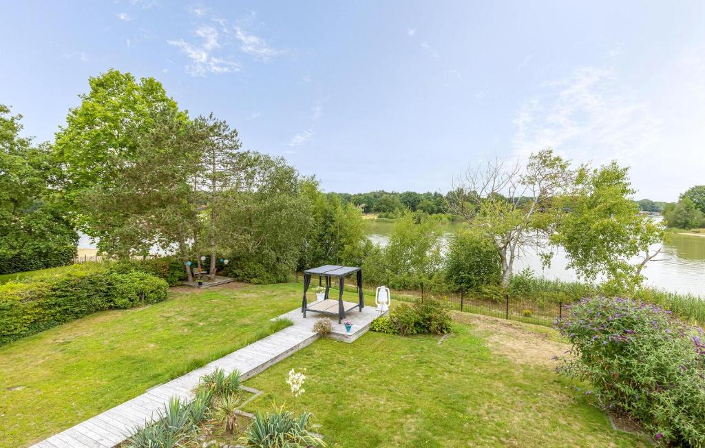 a picnic table in a park next to a river at Nice Home In Erm With Wifi in Erm