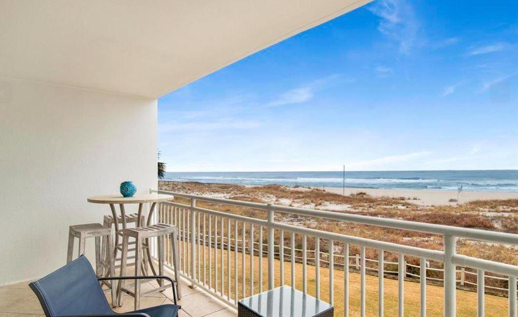 a balcony with a view of the beach at SeaSpray West 203-Gulf Front in Perdido Key